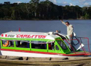 Carlos, our guide, waving from the bow of the Carlitos, near Oceanía.