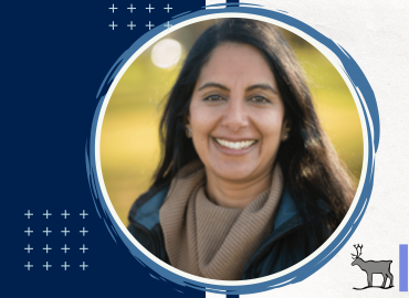 Professional headshot of the speaker of this seminar, Dr. Rashmi Chadha. She is smiling towards the camera infront of a blurred outdoor background.